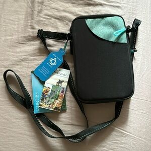 Never used Sherpani Travel crossbody bag! Locking waterproof pocket & scan proof